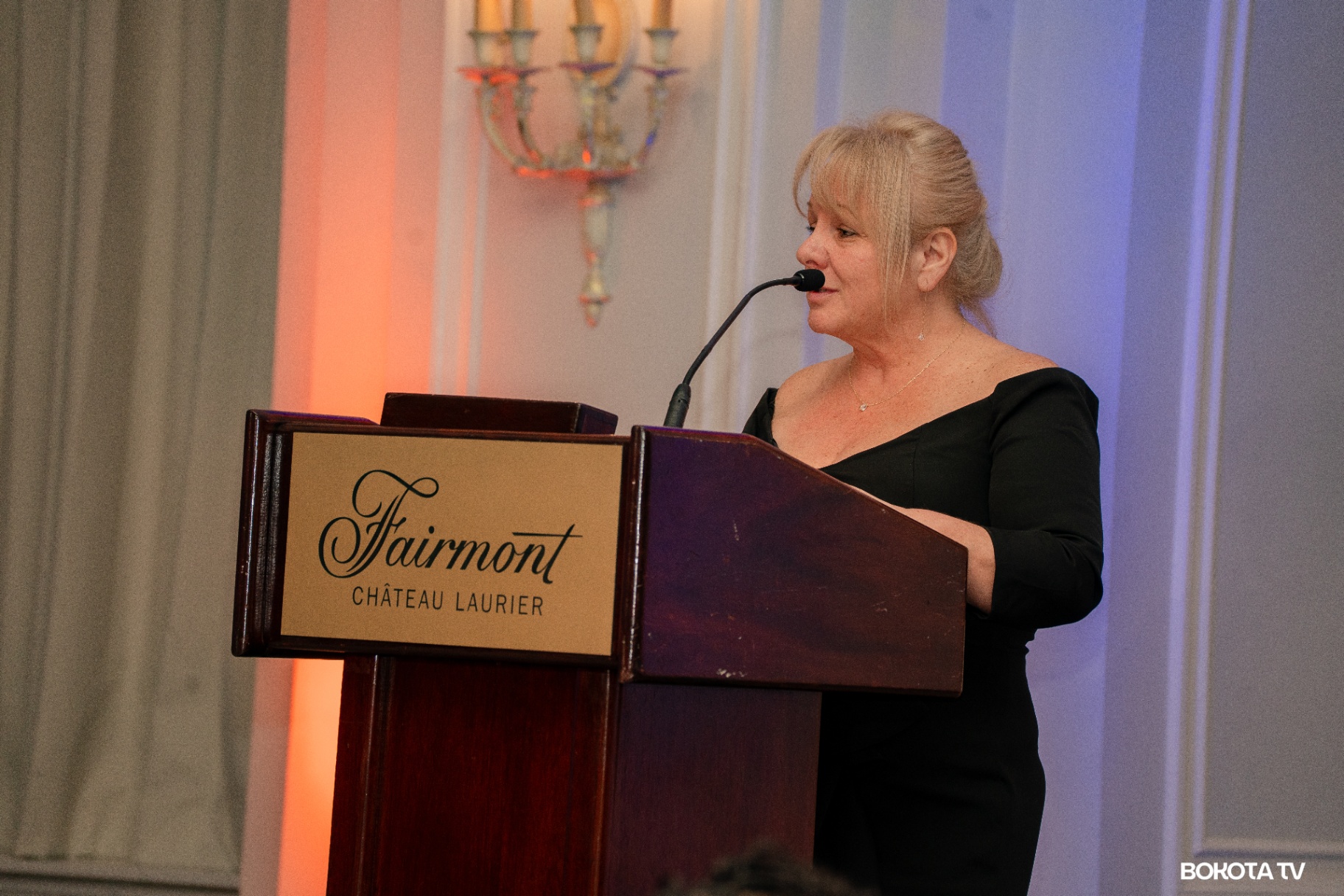 2025 Mbombo Gala Night at the Fairmont Château Laurier — speaker at the podium, hosted by Mbombo Investment Group